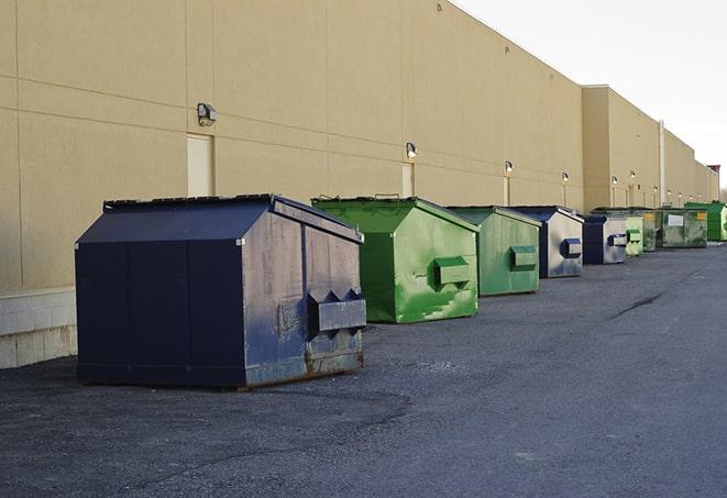 a row of industrial dumpsters for construction waste in Boggstown